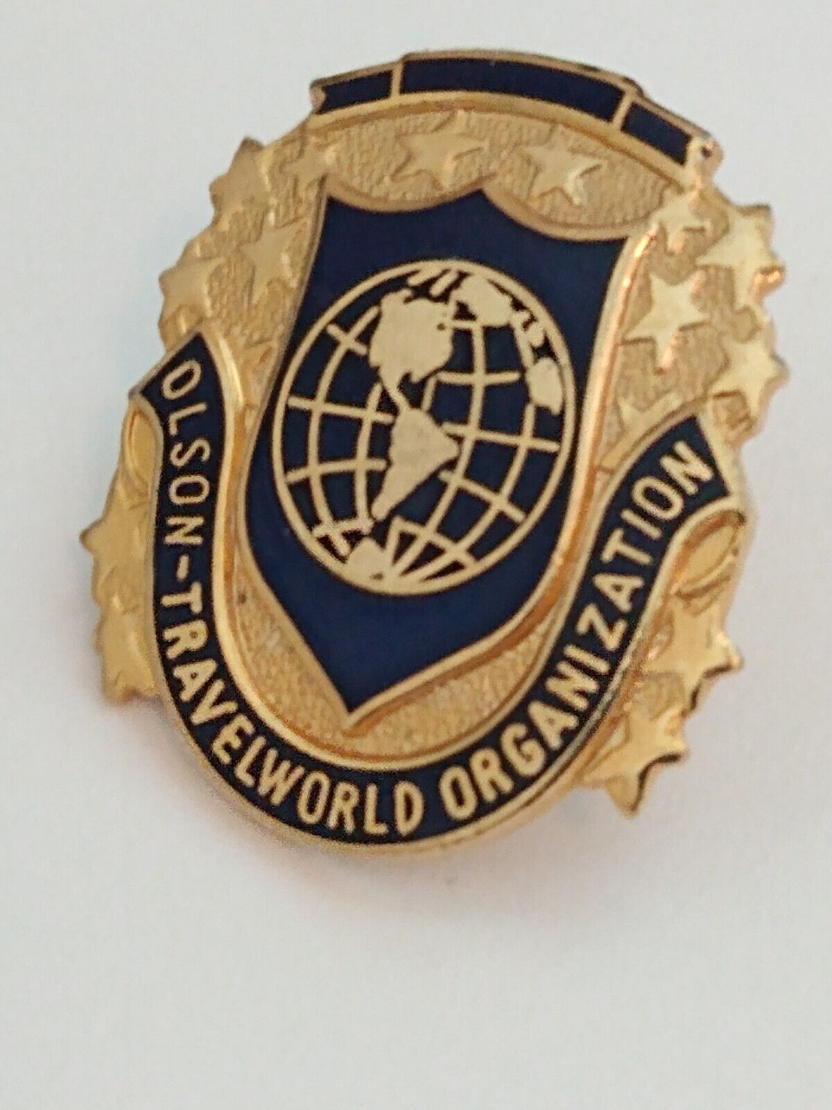 Olson-Travelworld Organization Lapel Pin