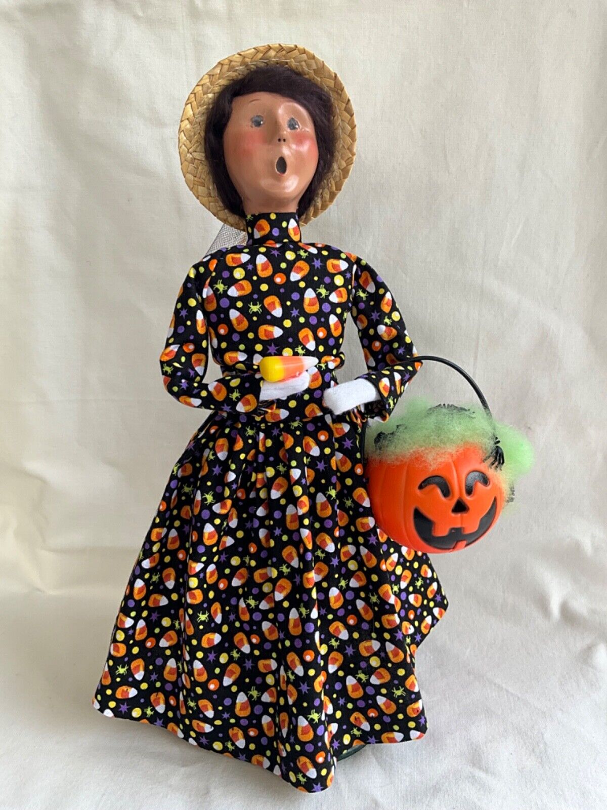 Byers Choice Woman in Candy Corn Outfit holding Pumpkin w/ Spiders  & Candy Corn