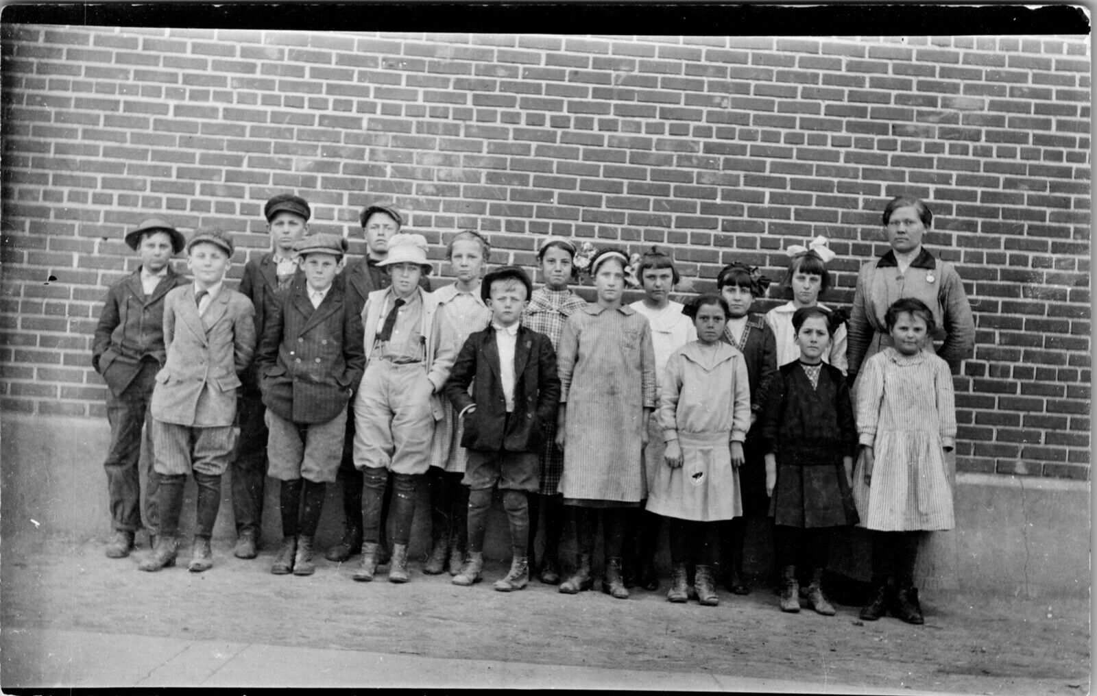 RPPC Schoolchildren and Teacher Brick Wall approx 1920s