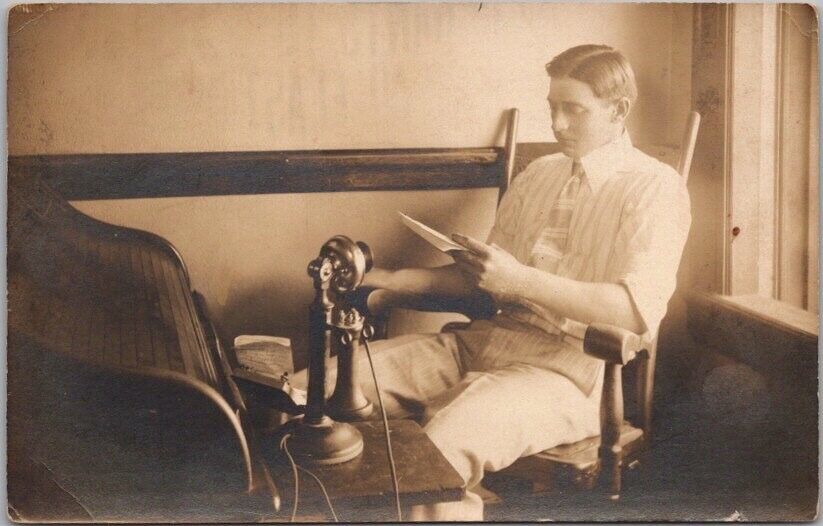 c1910s RPPC Real Photo Postcard Young Man in Office / Candlestick Telephone