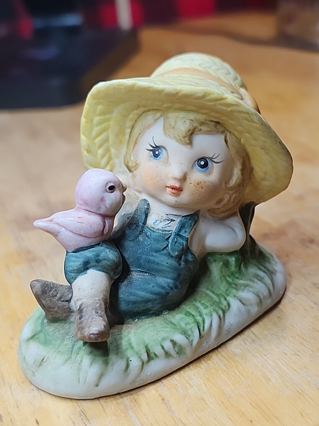 Vintage Lefton Figurine. Country girl. Overalls. Straw Hat. Bird. Relaxing.