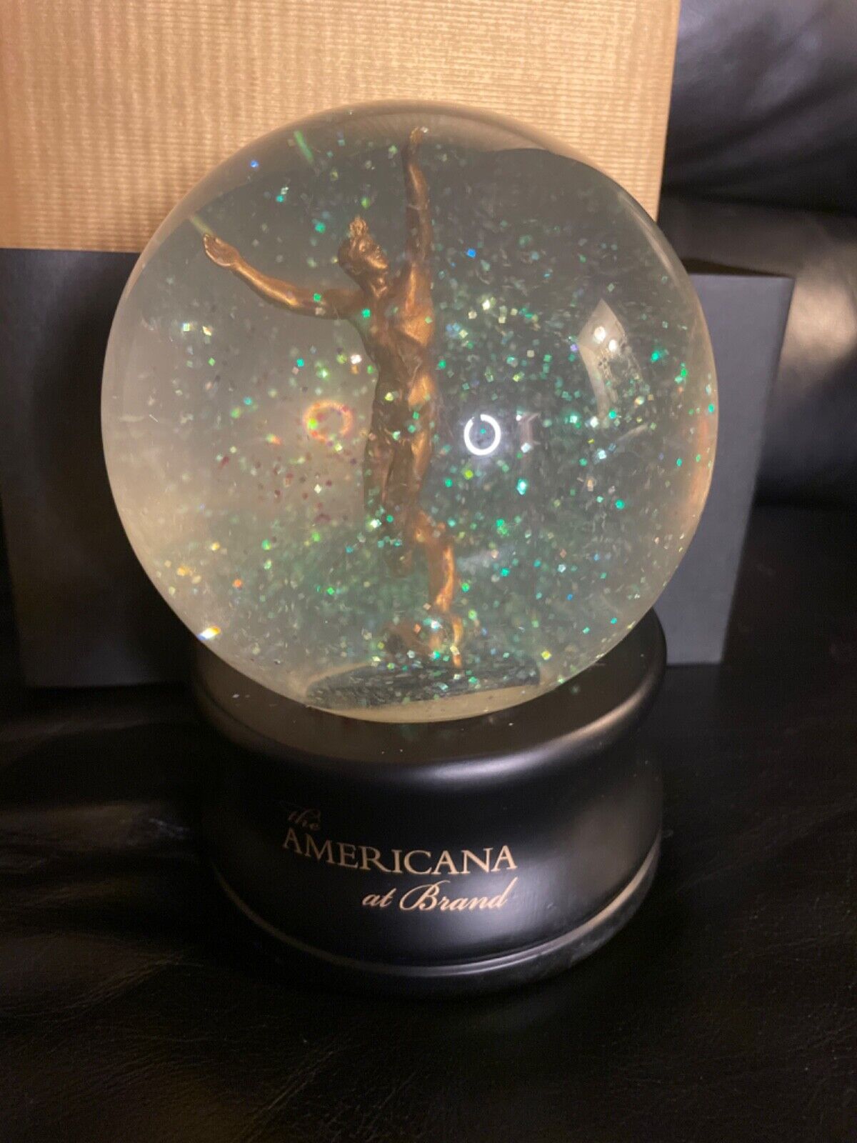 New in Box The Americana at Brand Snow Globe- gilded man spirit of American yout