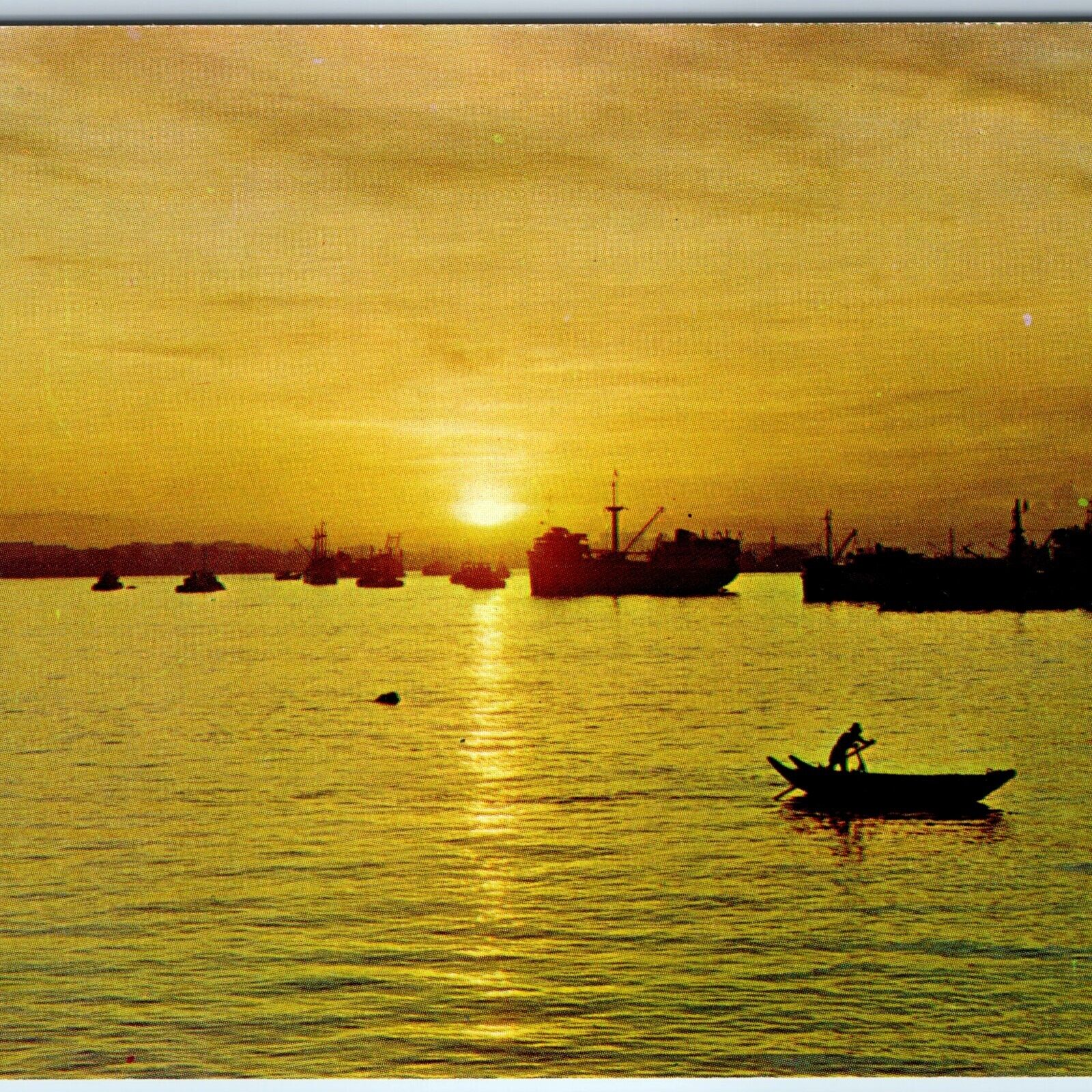 c1960s Singapore Sunrise Over Horizon Man in Row Boat Port Navy Ship Sun PC A227