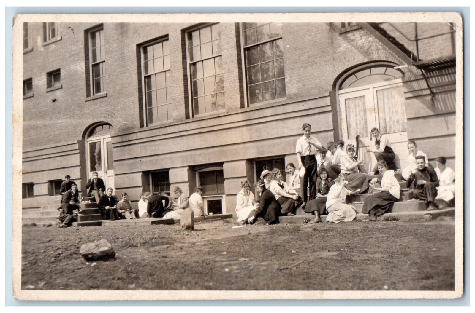 c1910\'s Postcard RPPC Photo Teenage Children Having Lunch Outside School Campus