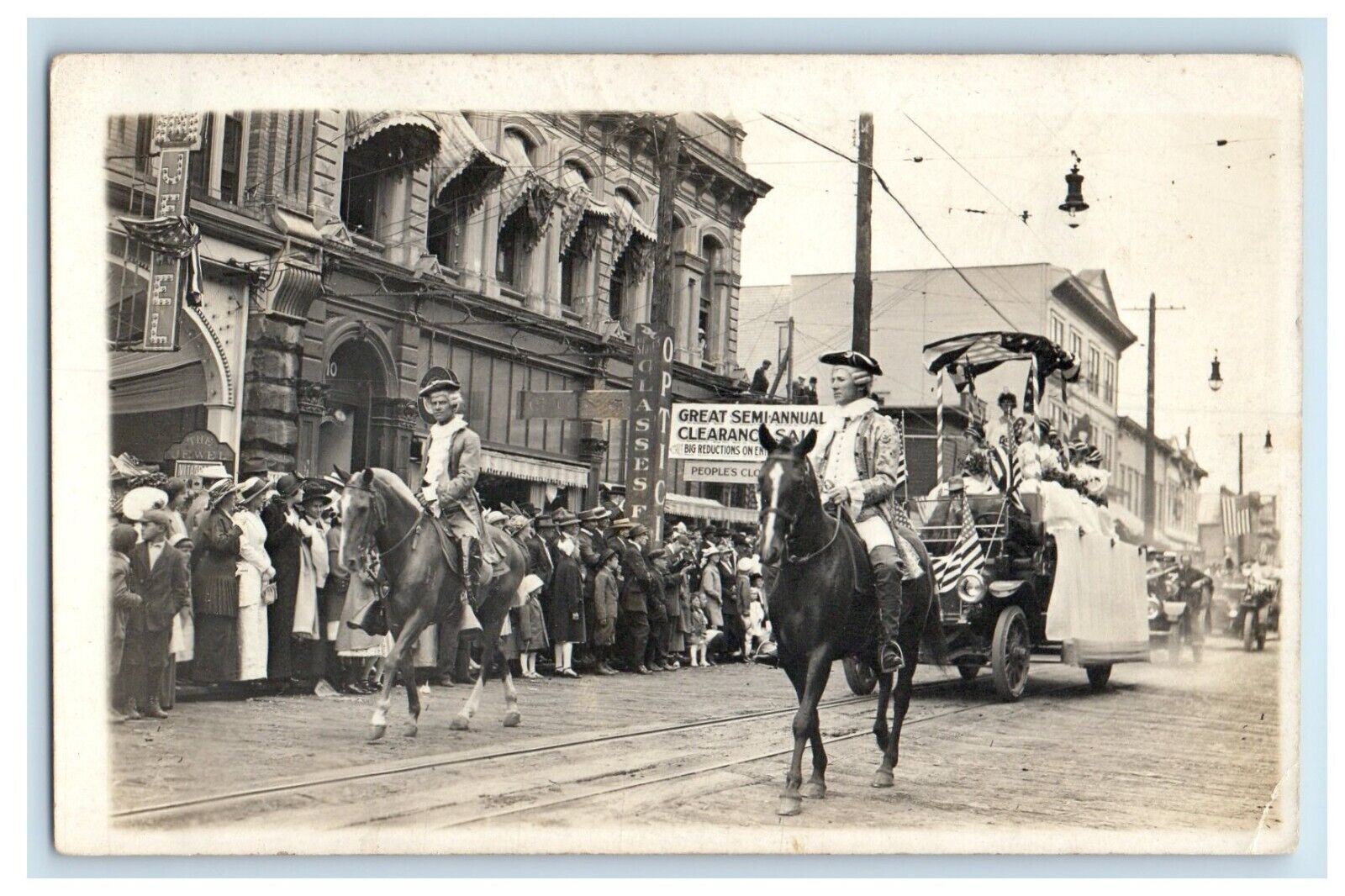 c1910's Patriotic Parade Main Street Jewel Optometrist Kids RPPC Photo Postcard