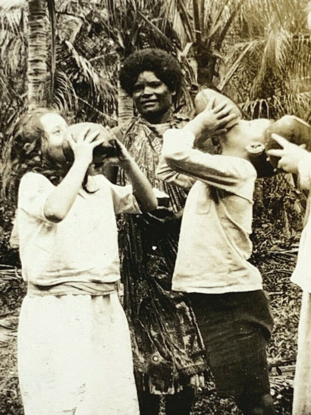 C8 Found Photograph White Family Drinking Coconuts From Indigenous Native Tribe