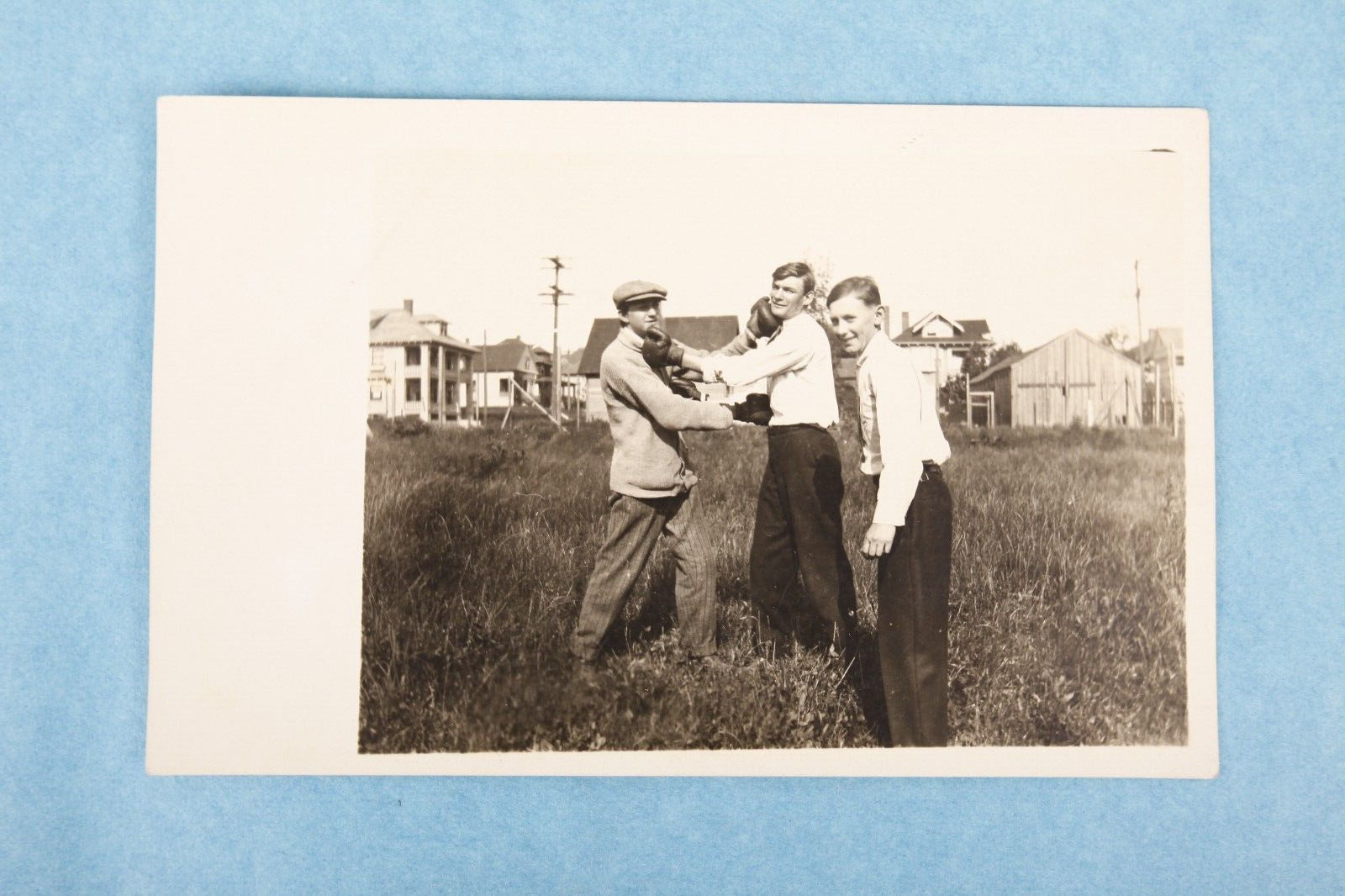 VINTAGE RPPC EARLY 1900s 3 BOYS BOXING & PLAYING IN FIELD POSTCARD