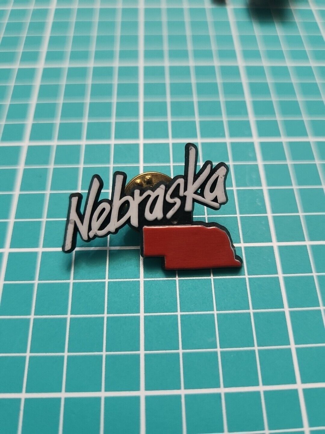 Vtg Nebraska State Shape Black Plastic Lapel Pin