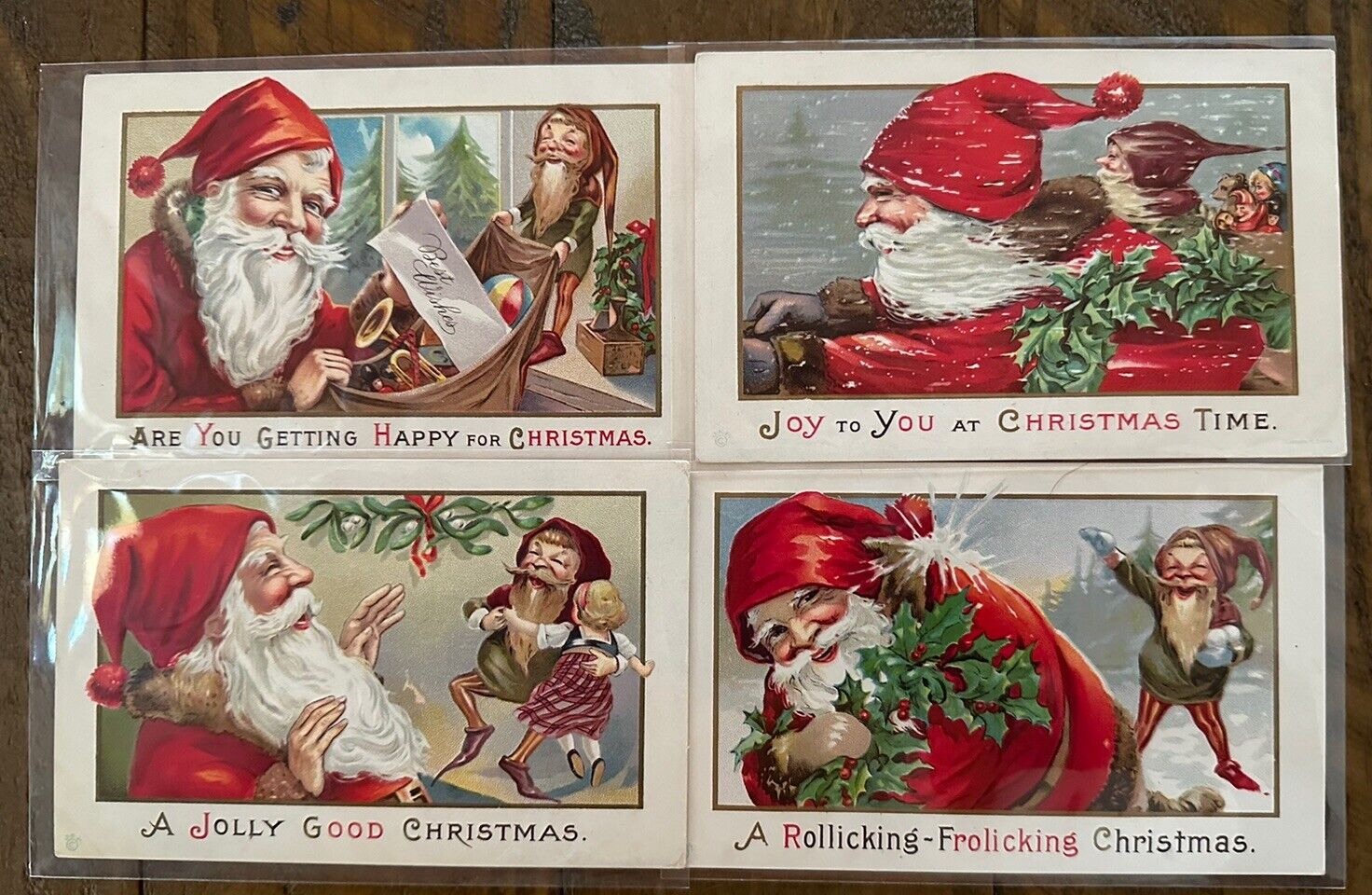 Lot of 4~SANTA CLAUS~with Elves~Gnomes~ Antique Christmas Postcards Set~k707