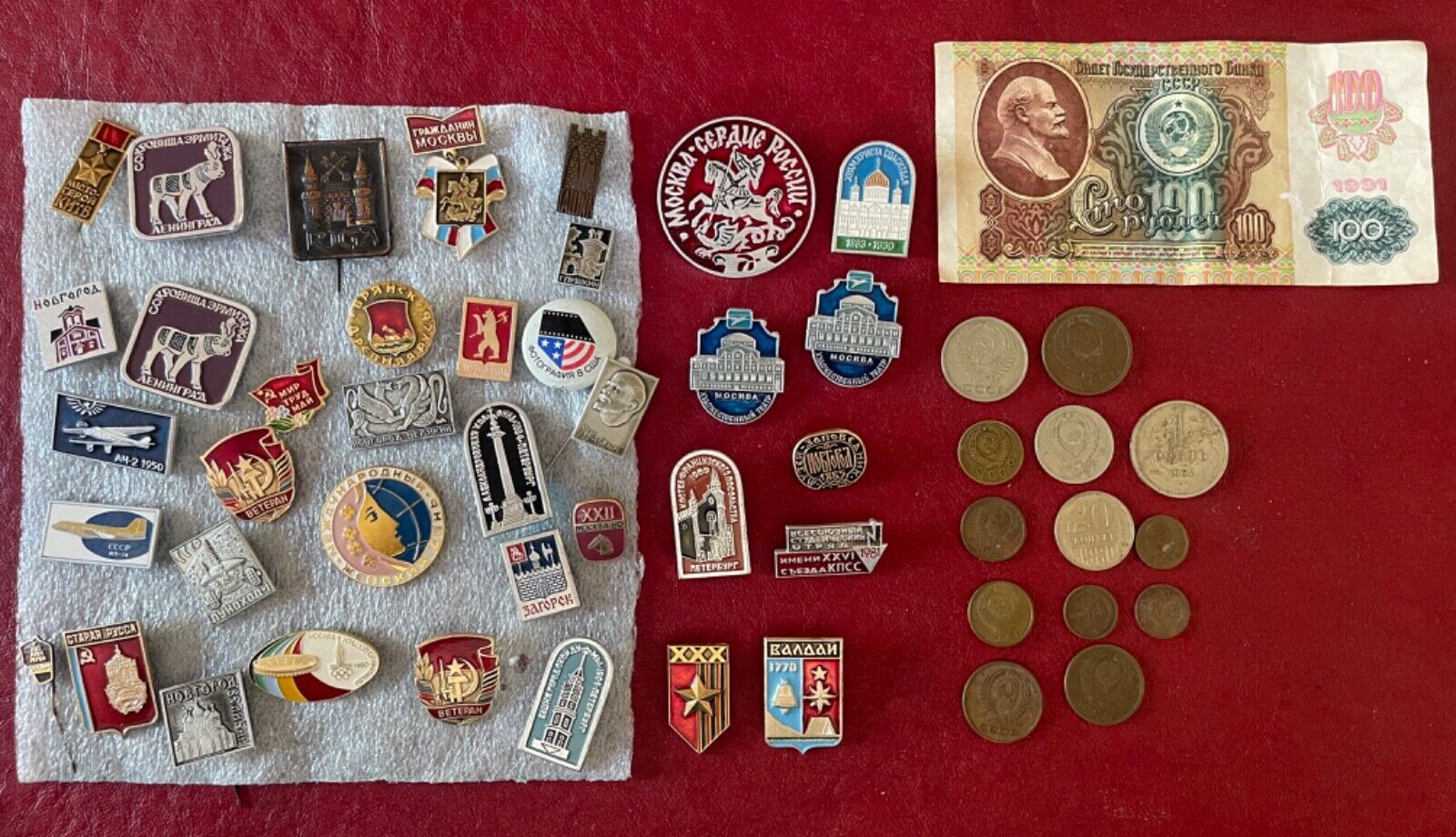 Soviet pins, Soviet kopek pieces, Soviet ruble note. A bunch of Soviet stuff.