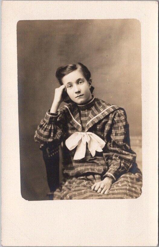 1910s Studio Real Photo / RPPC Postcard Bored Girl in Plaid Dress / Head on Hand