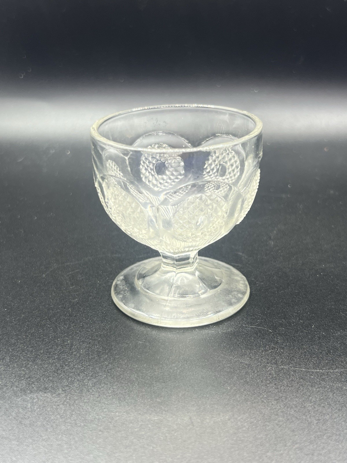 ANTIQUE US GLASS LEAF & DART CLEAR PRESSED GLASS OPEN PEDESTAL SALT NUT DISH