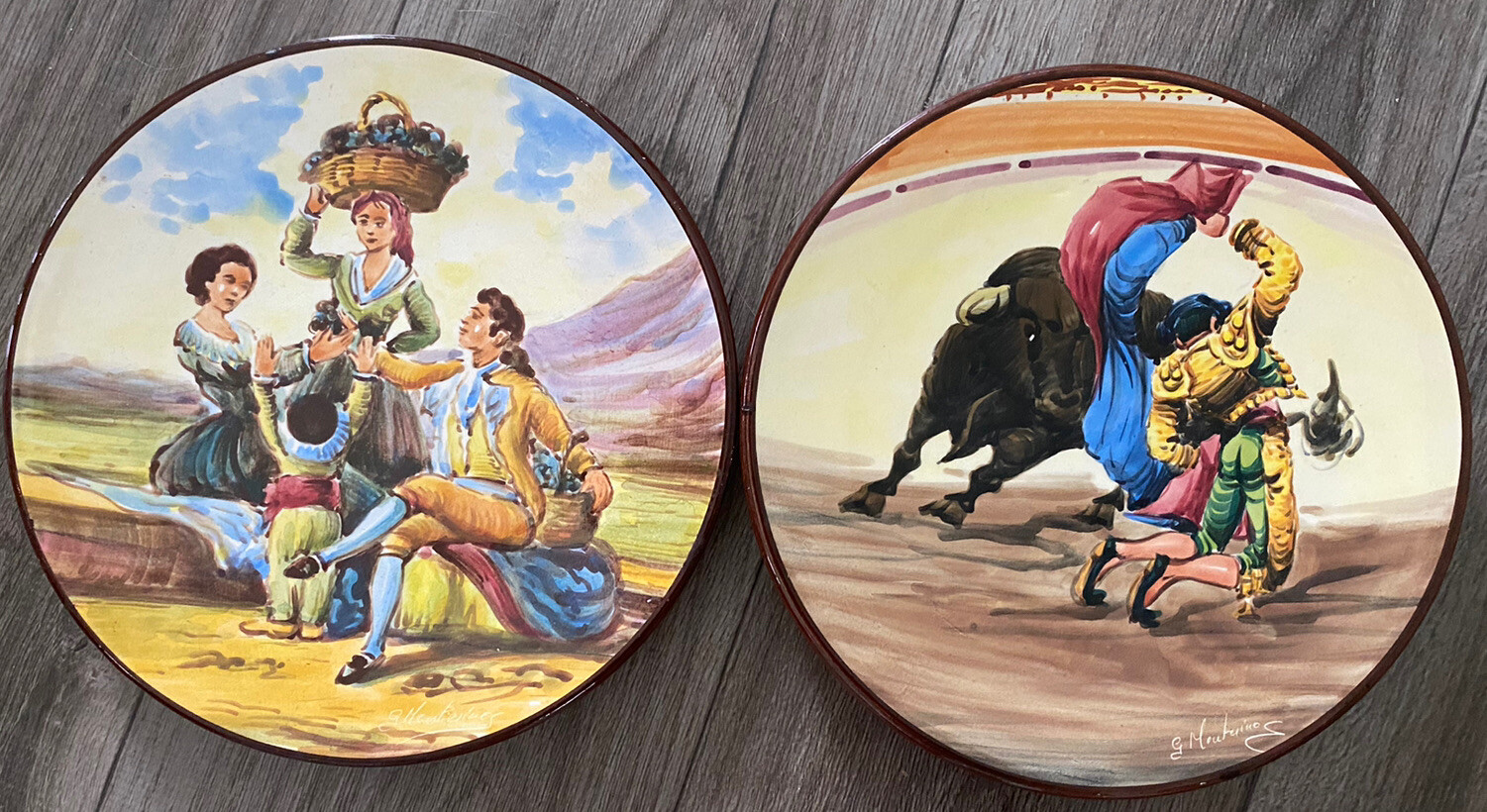 2 Vtg hand painted wall plates. Grape harvest, matador & bull fight. Signed.