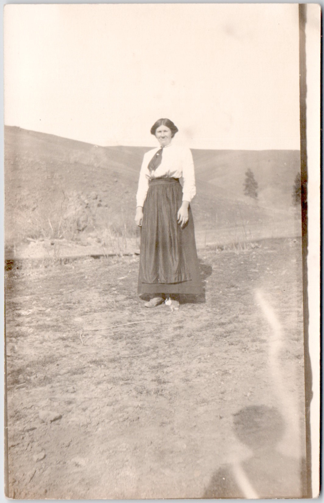 c1909 Woman Standing on Rural Hillside RPPC Postcard Scenic Outdoor Portrait