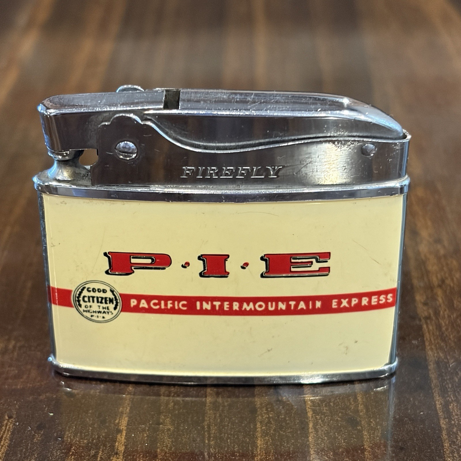 Vintage Pacific Intermountain Express Trucking P.I.E. Firefly Lighter Very Good