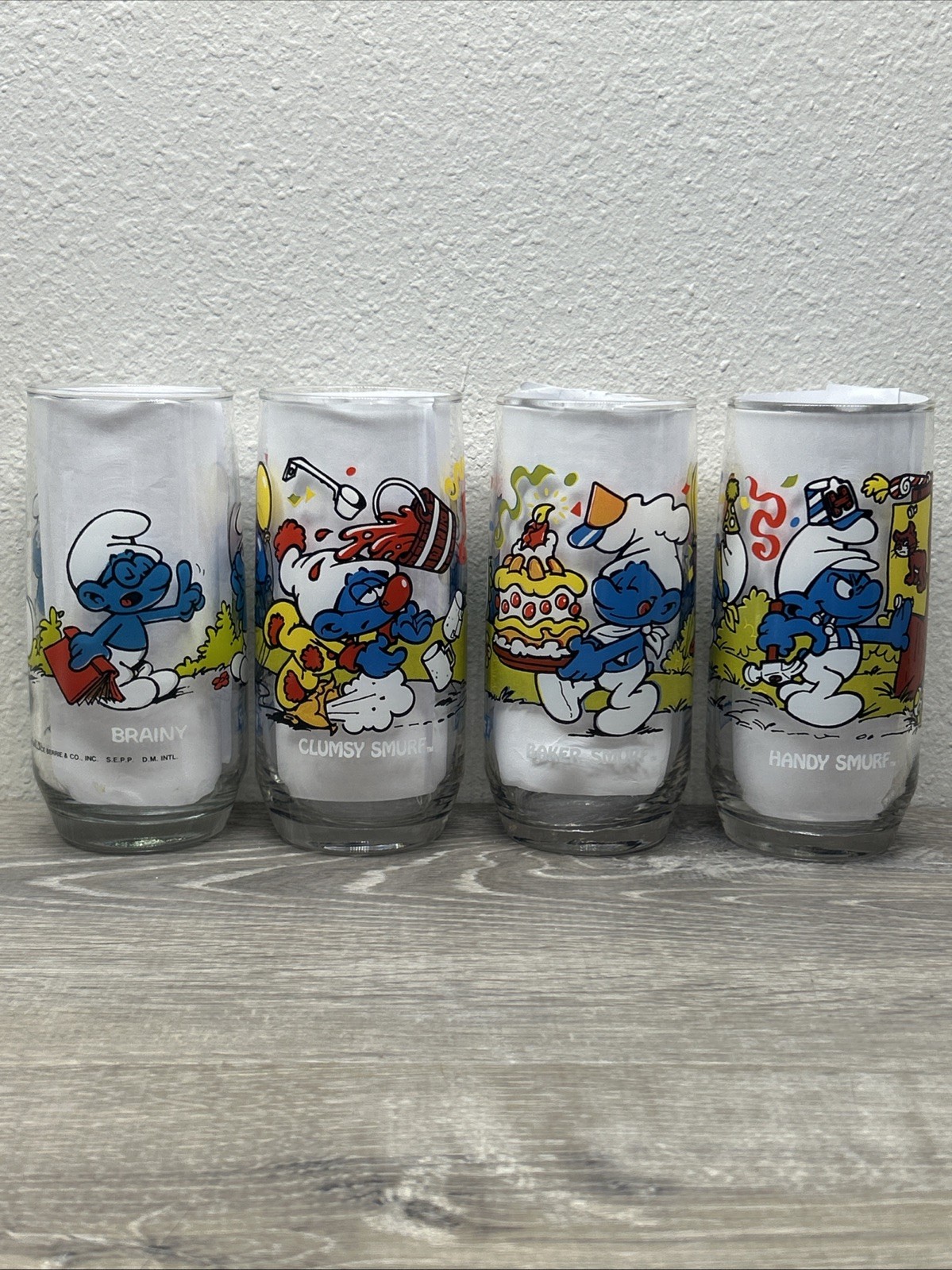VINTAGE Set Of 4 Glasses 1982-83 The SMURFS-Baker, Clumsy, Brainy & Handy Smurf