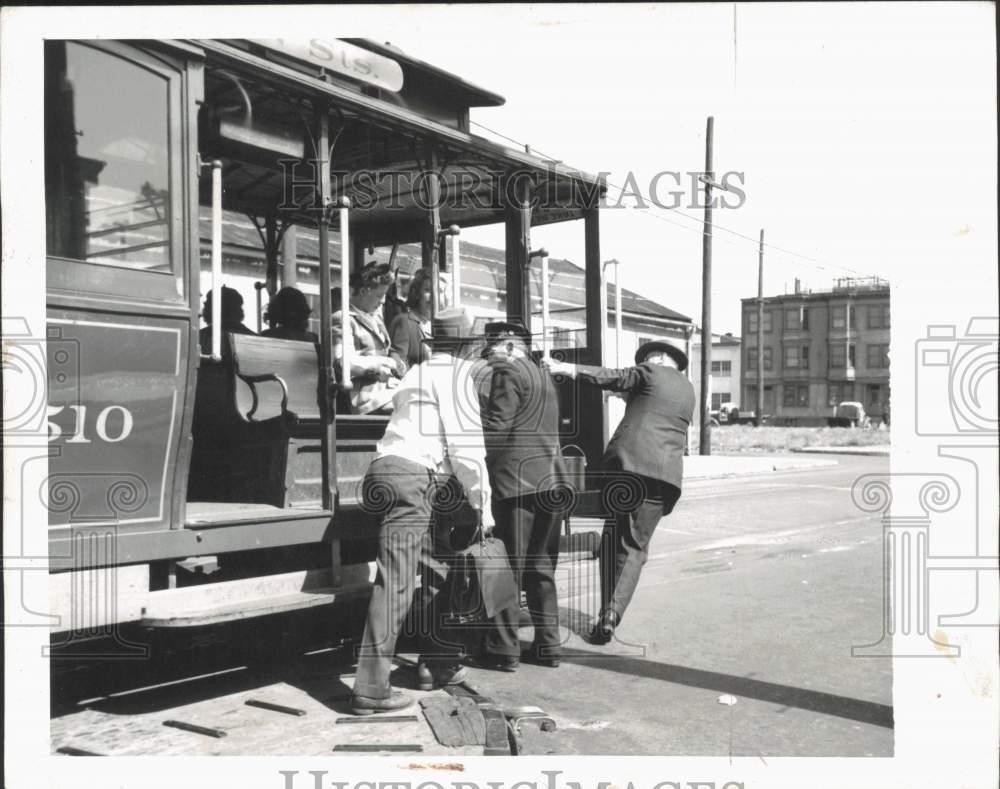 1944 Press Photo San Francisco, Calif. cable car at turntable and men help out