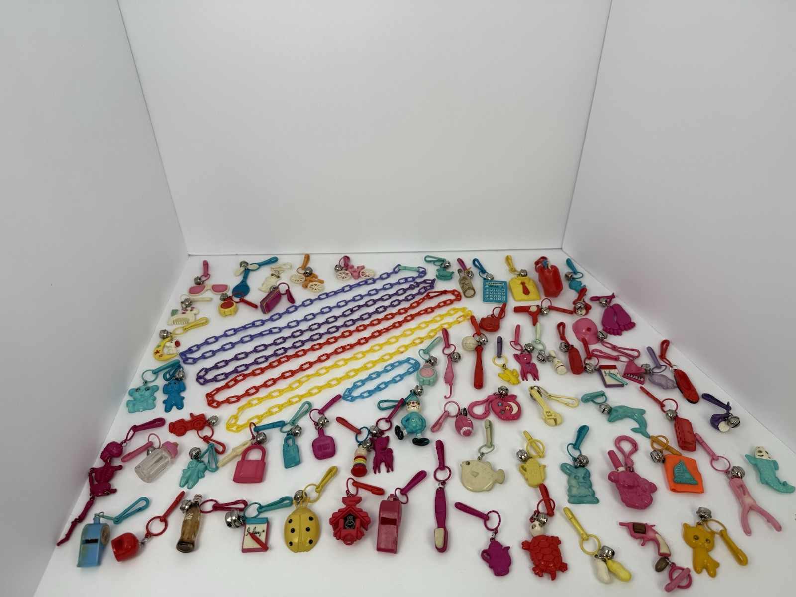 1980\'s Vintage Plastic Clip-On Bell Charm Necklace 67 Charms 100” Long RARE LOT