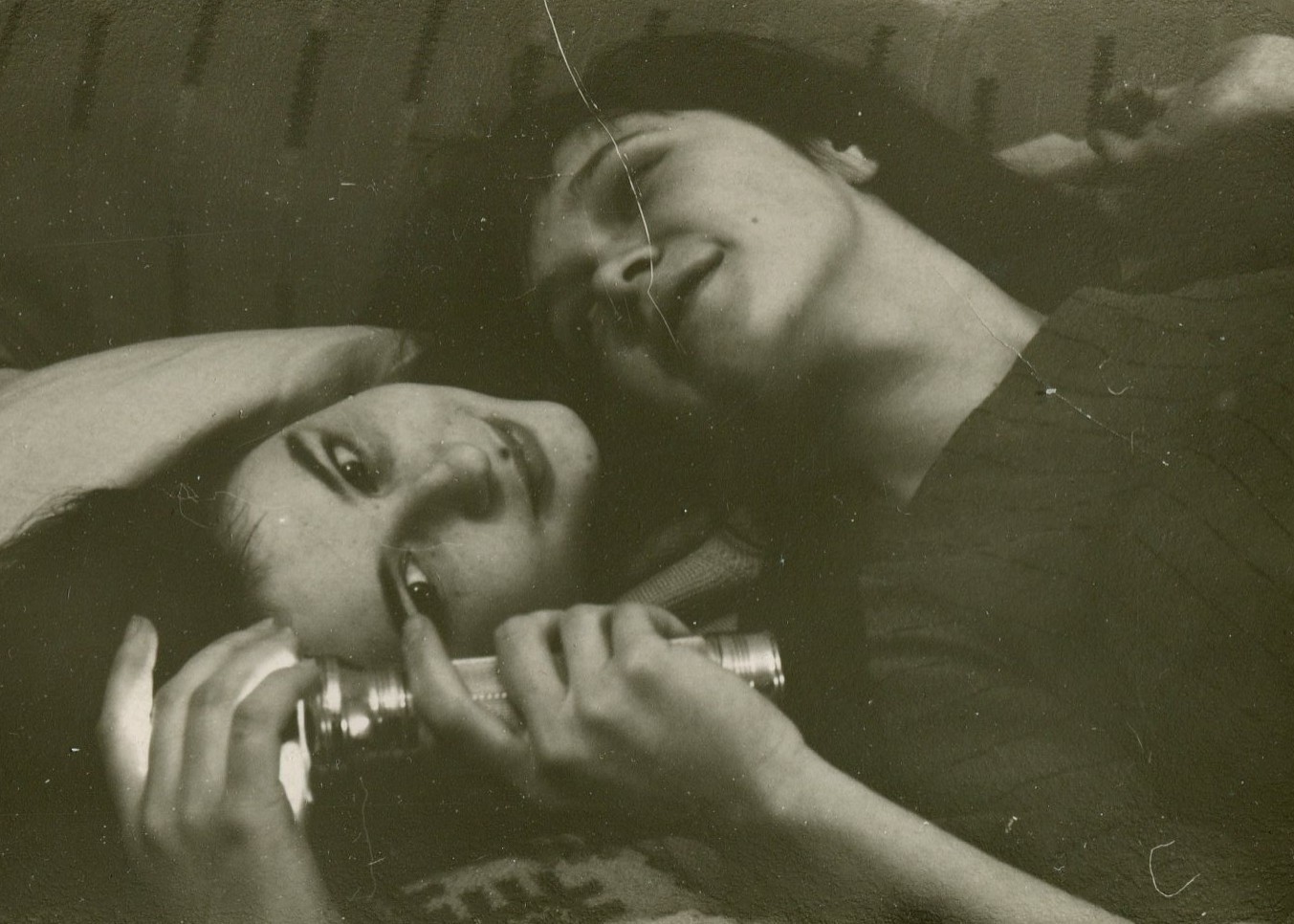 Pretty young women couple above to kiss lesbian int vintage photo