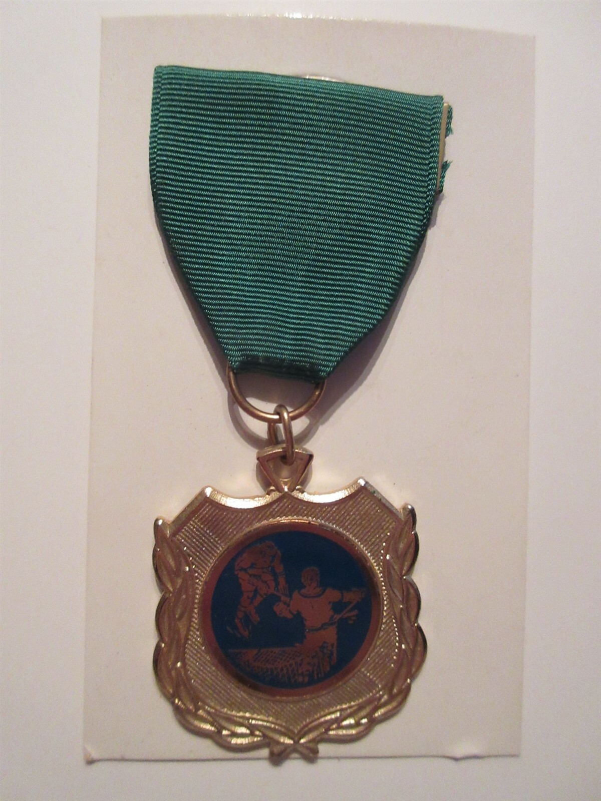 Vintage Hockey medal on card 1960\'s