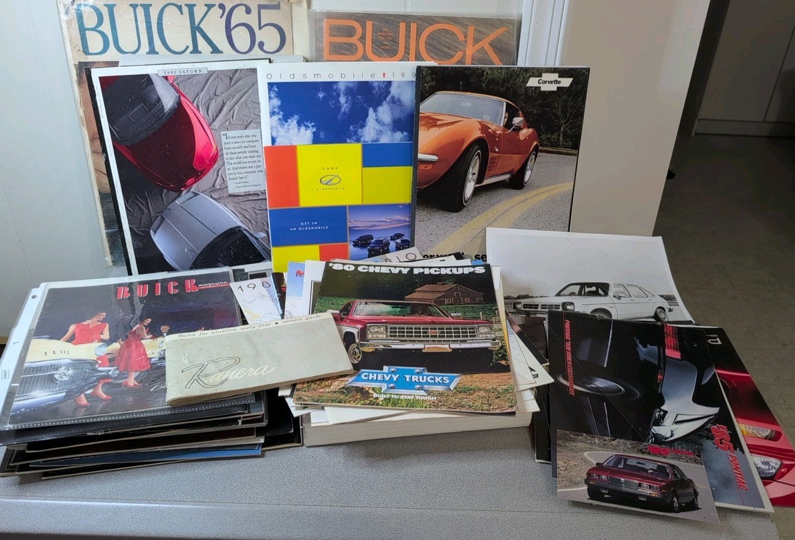 Lot of 52 Vintage GM Dealer Promo Brochures 55-00s Chevy Olds Pontiac Buick 