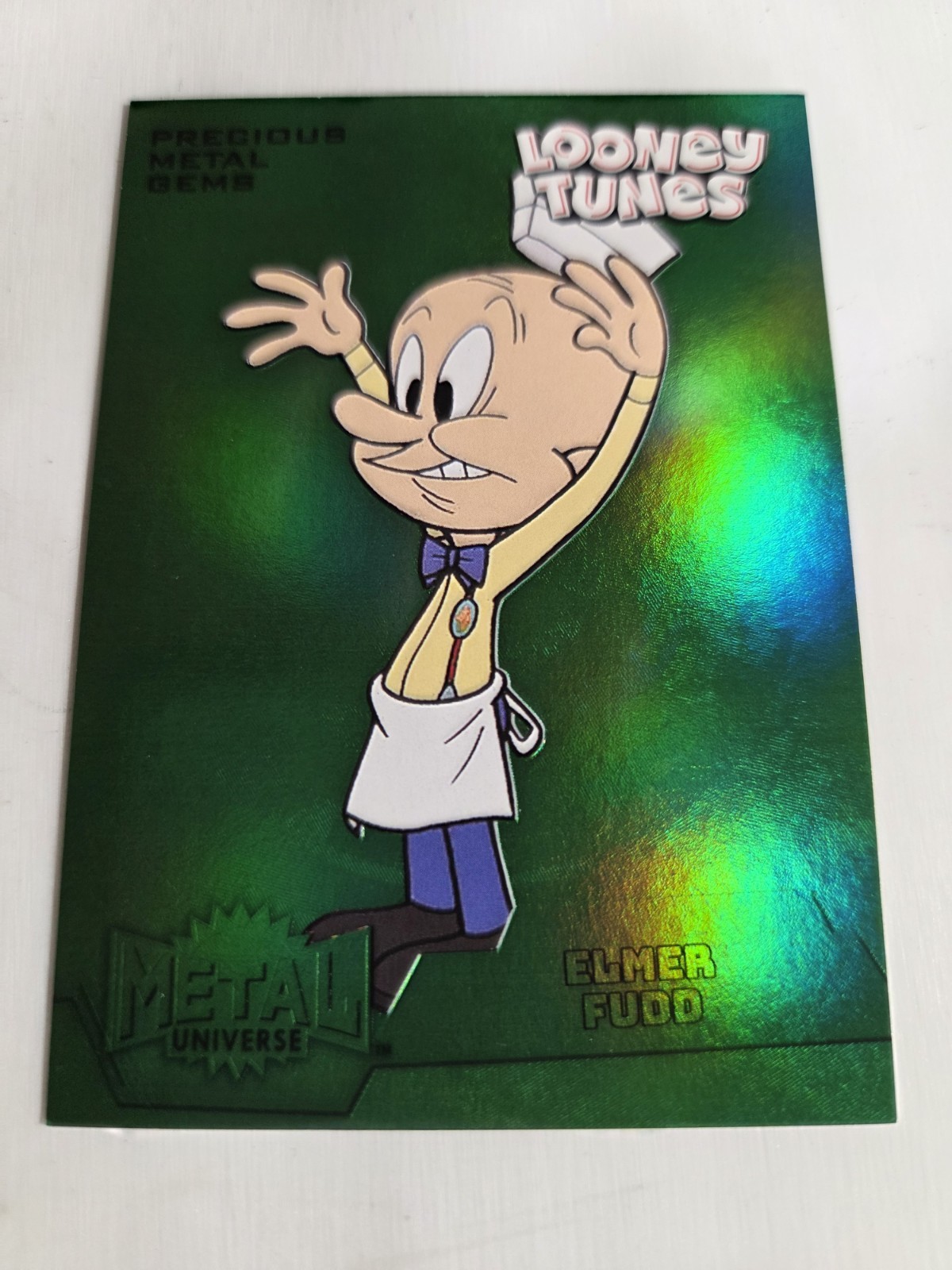 Elmer Fudd - 2024 Fleer Retro Looney Tunes #Mu-27 Precious Metal Gems Green 4/10 Elmer Fudd - 2024 Fleer Retro Looney Tunes #Mu-27 Precious Metal Gems Green 4/10