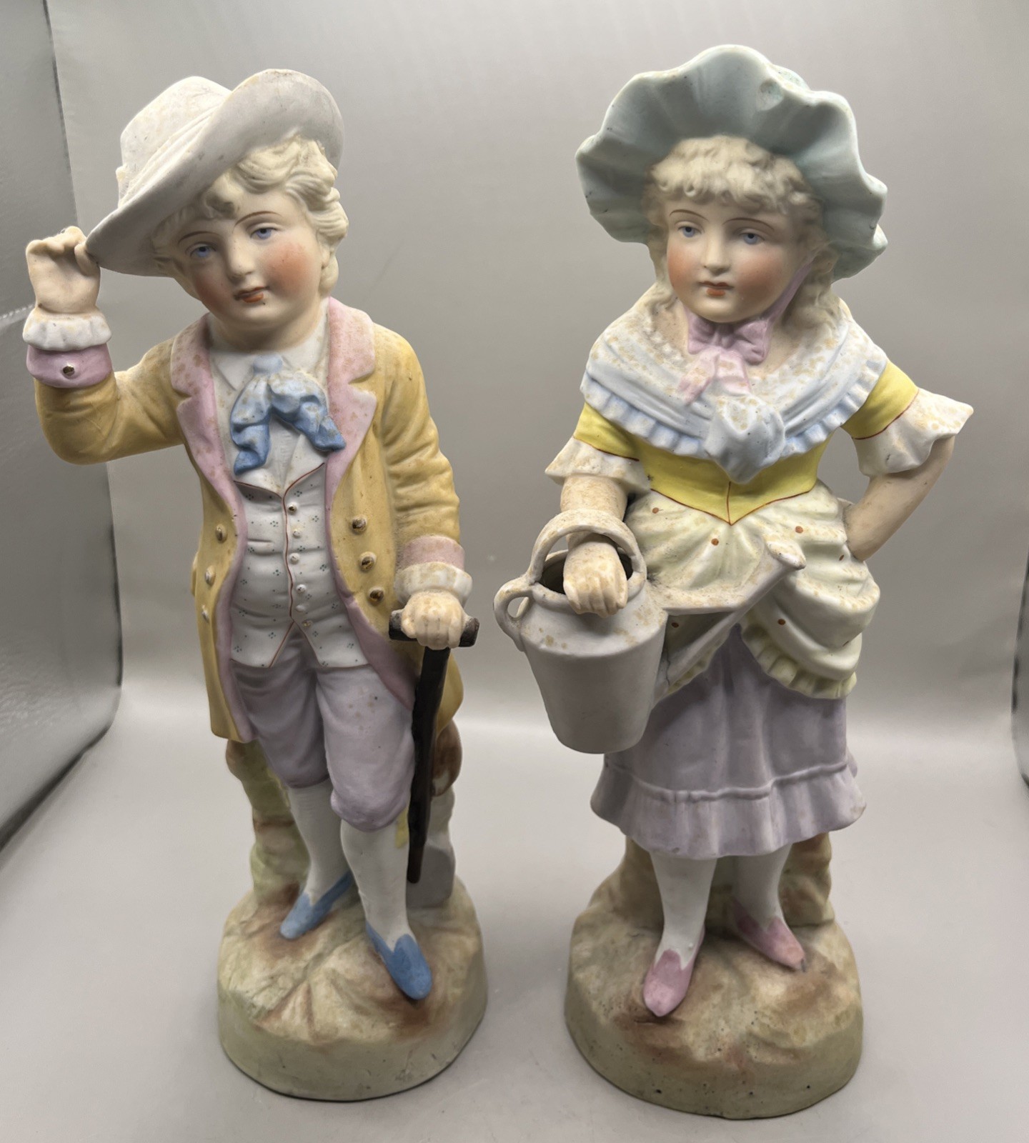Pair Antique German Painted Bisque Porcelain Boy w/Cane & Girl w/Pot Figurines
