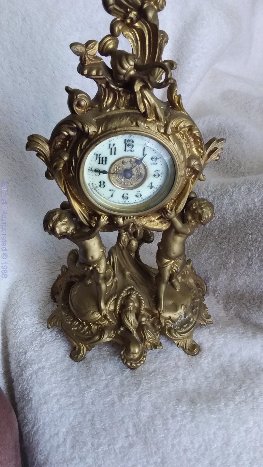 Spelter Boudoir Clock With Cherubs clock not moving or ticking, just the hands
