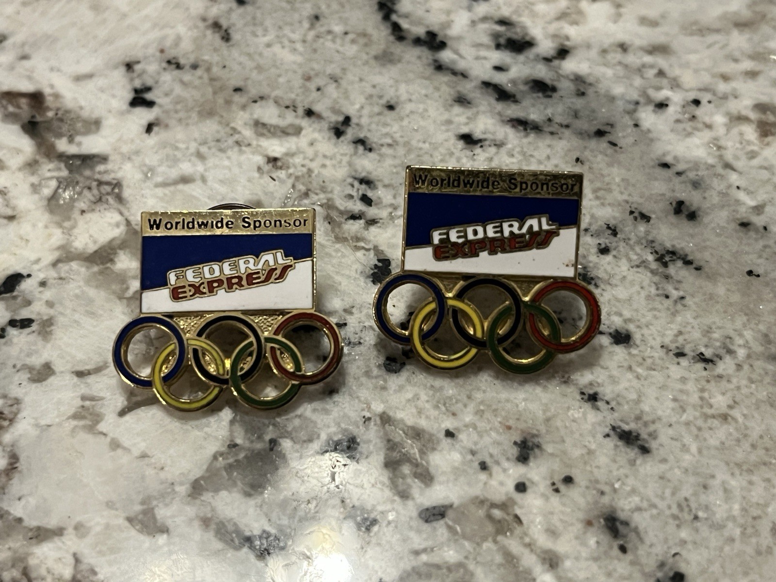 vintage Federal Express Olympic lapel pins
