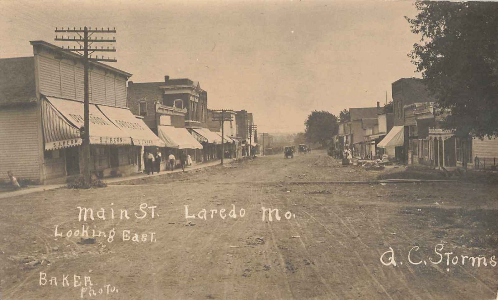 1910s RPPC Photo Postcard Main Street Scene Laredo Missouri Storefronts Baker