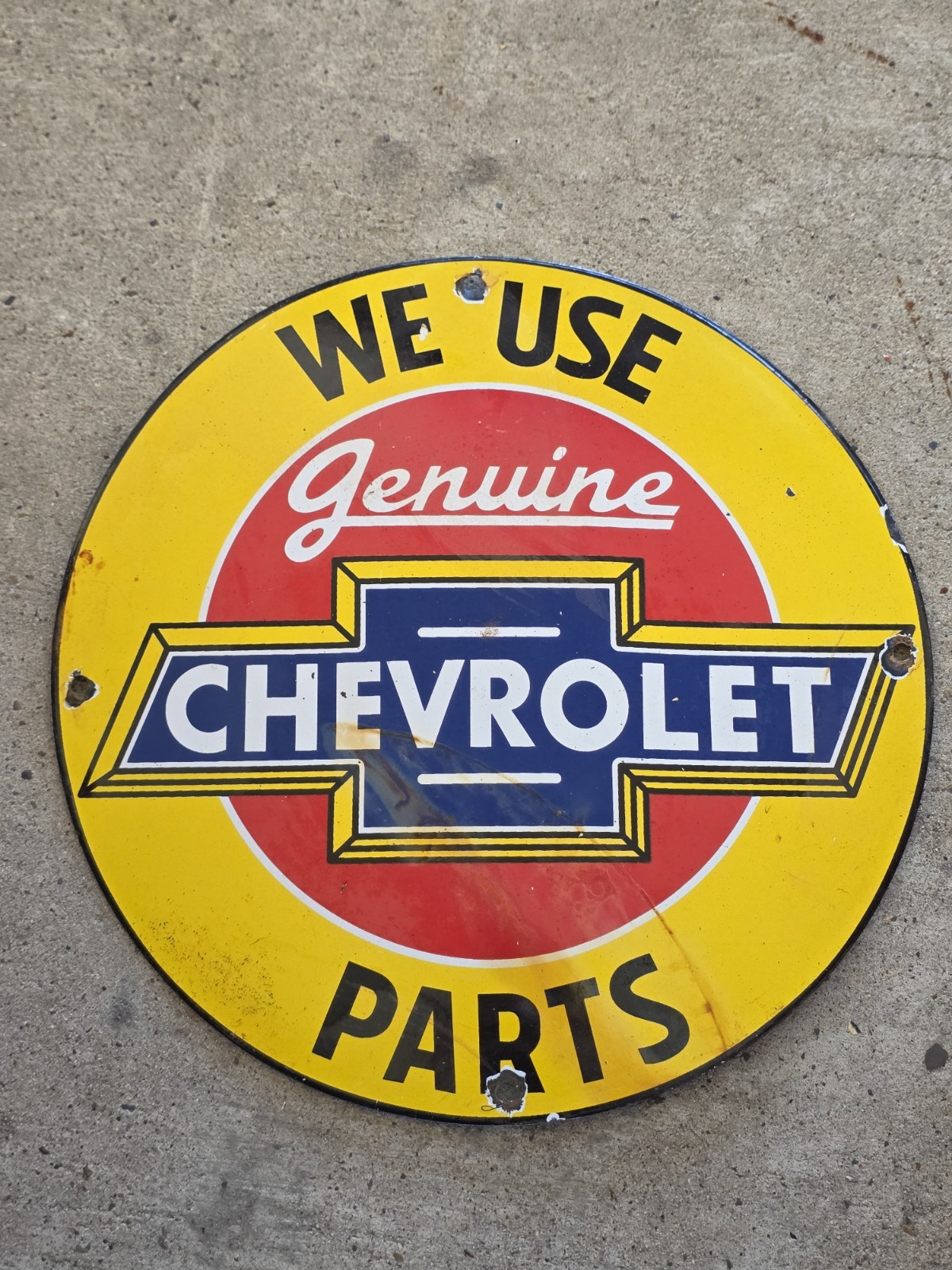 VINTAGE WE USE GENUINE CHEVROLET PARTS PORCELAIN SIGN 12 VINTAGE WE USE GENUINE CHEVROLET PARTS PORCELAIN SIGN 12