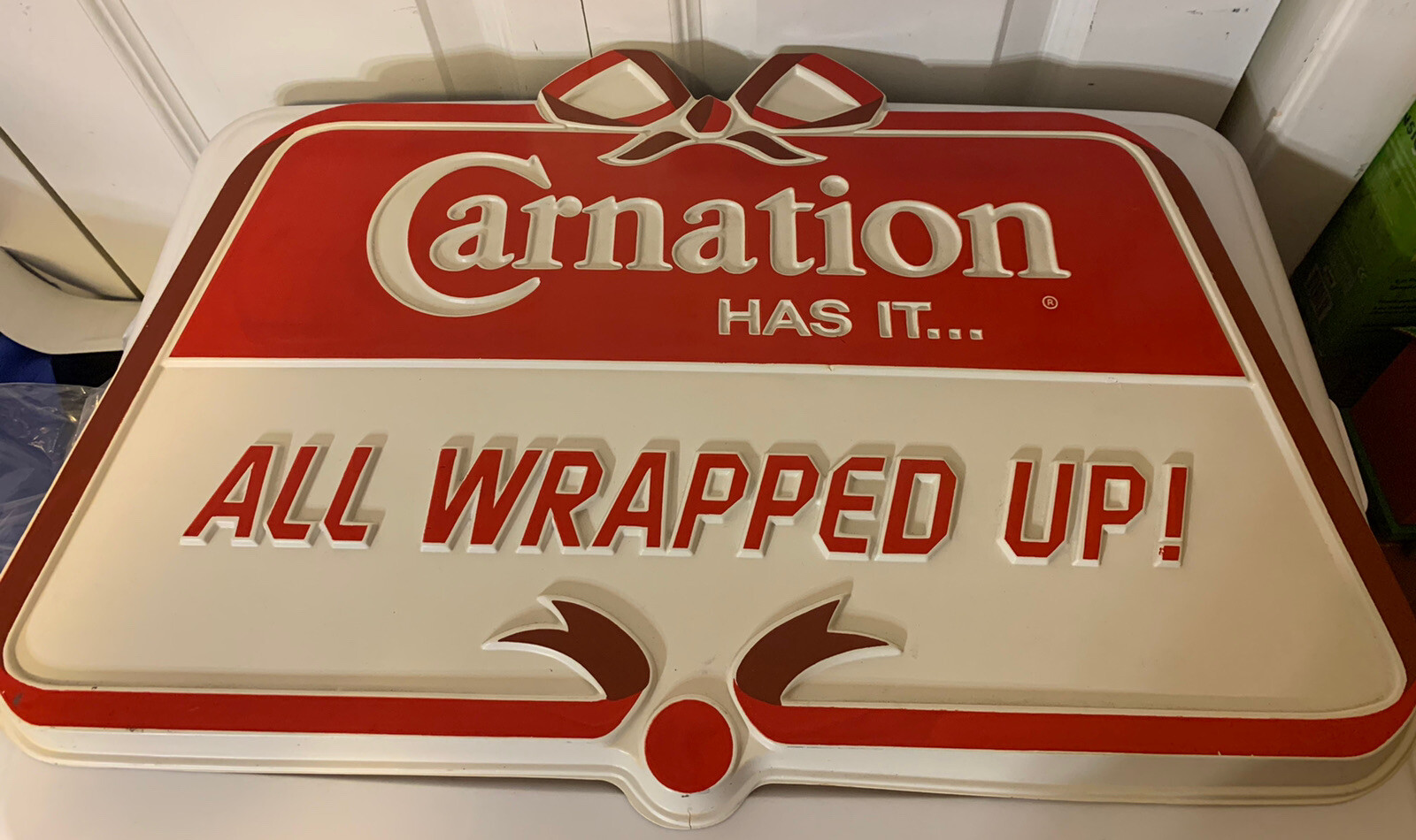 Vintage Carnation Has it   All Wrapped up Dairy General Store Sign Plastic