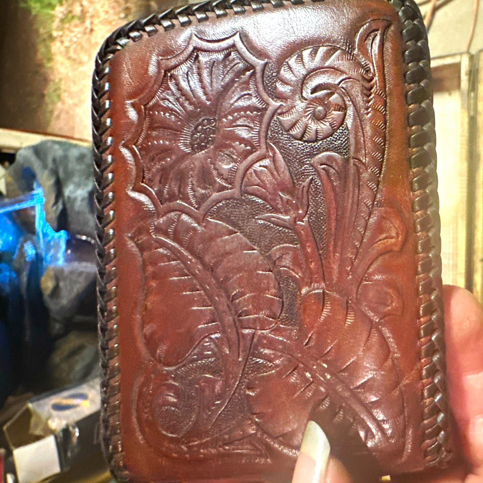 vintage 1960s–1970s western hand-tooled leather bifold wallet.
