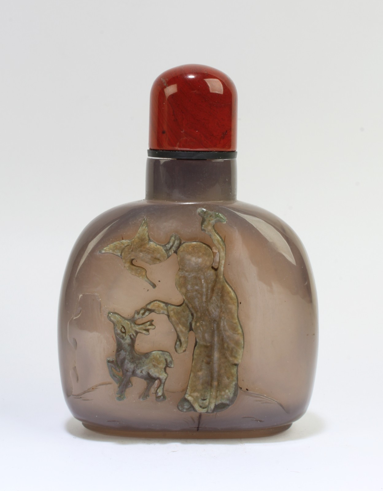 Chinese Amber Snuff Bottle, depicting a deity with an animal and a bird Chinese Amber Snuff Bottle, depicting a deity with an animal and a bird