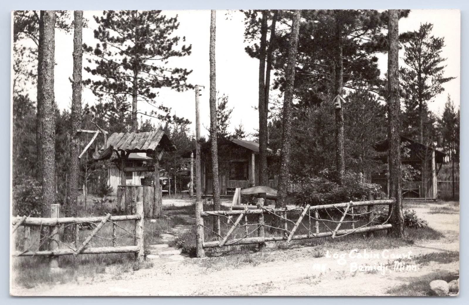 Bemidji Minnesota Log Cabin Court Old Car Roadside c1930s MN RPPC Postcard