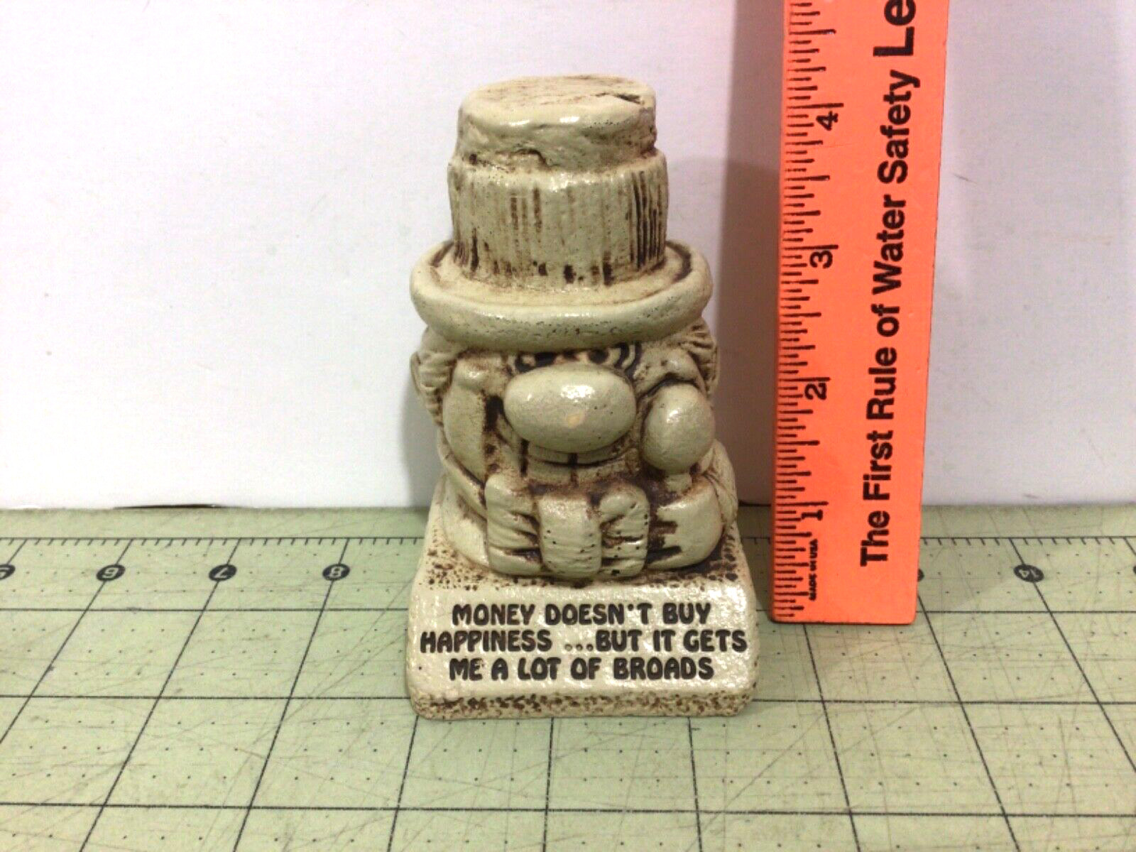 1976 Paula figure W-485, “Money Doesn’t Buy Happiness” 