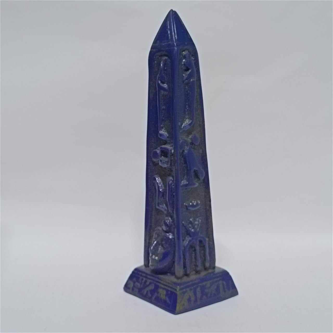 Blue Egyptian obelisk with hieroglyphs, glossy finish, ancient style collectible