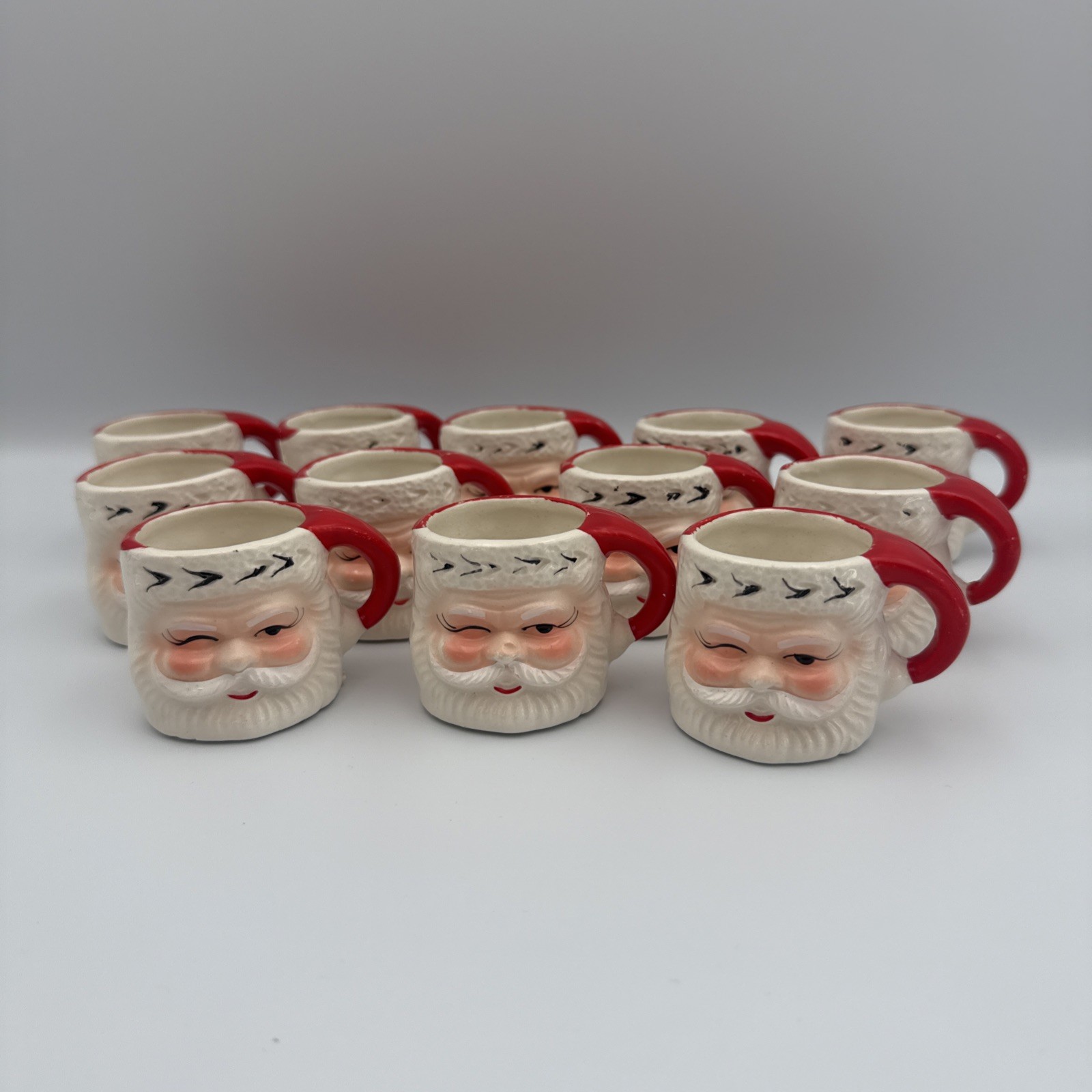 Lot of 12 Vintage Miniature Ceramic Winking Santa Claus Mugs Retro Holiday Lot of 12 Vintage Miniature Ceramic Winking Santa Claus Mugs Retro Holiday