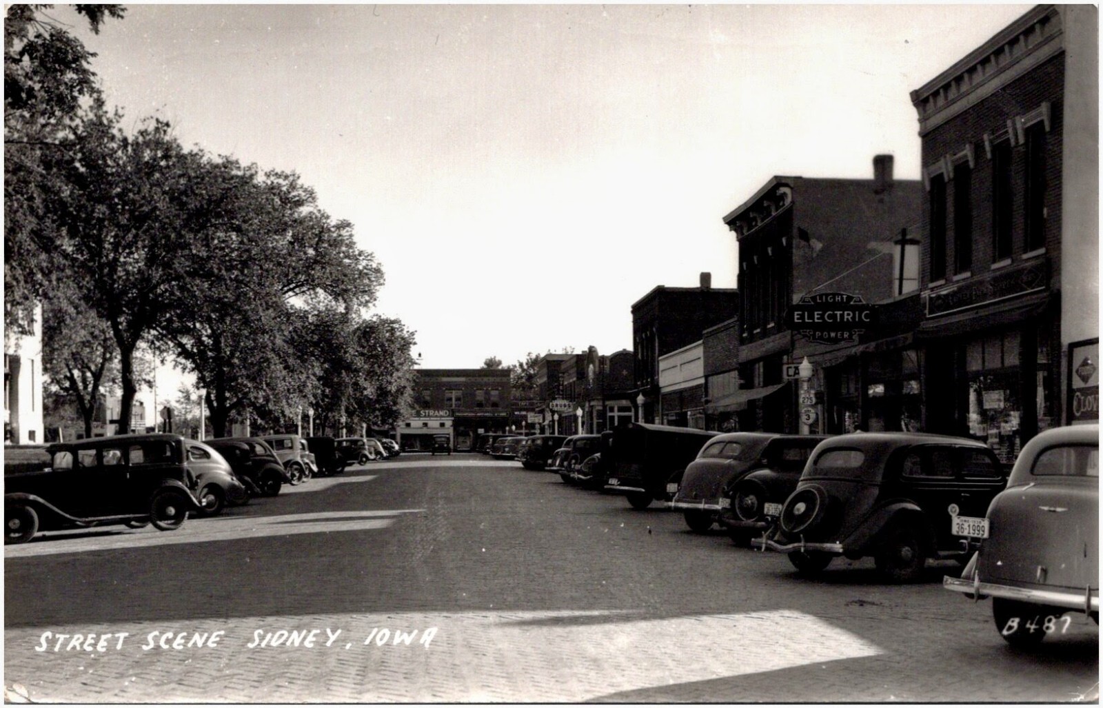 Illinois Street Sidney Iowa IA Penn Drugs Clover Farm Store 1940s RPPC Postcard