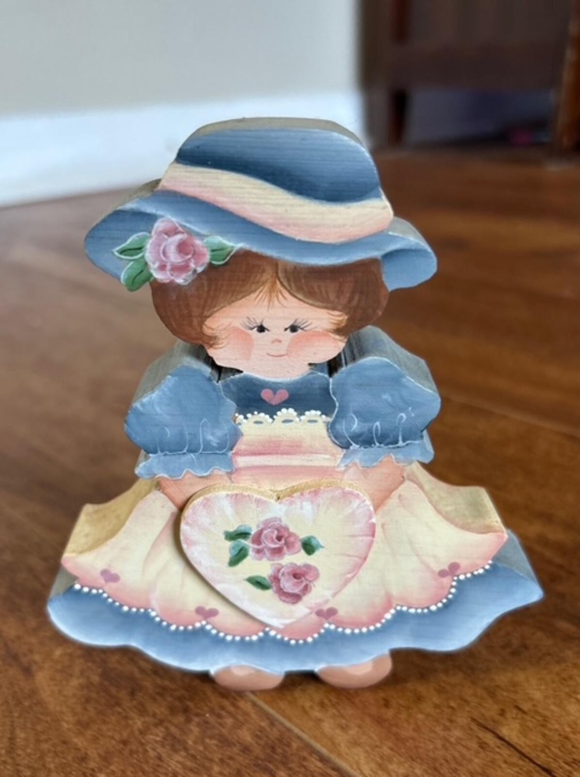 Hand-Painted Wooden Girl Figurine with Floral Heart