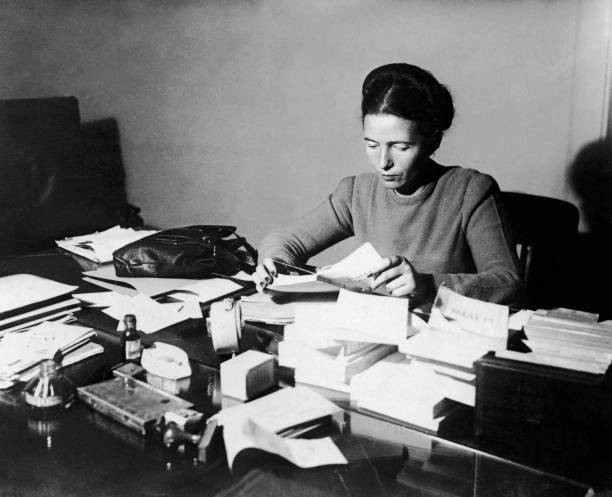The French writer Simone de Beauvoir seated Reading at Her Desk 1953 Old Photo