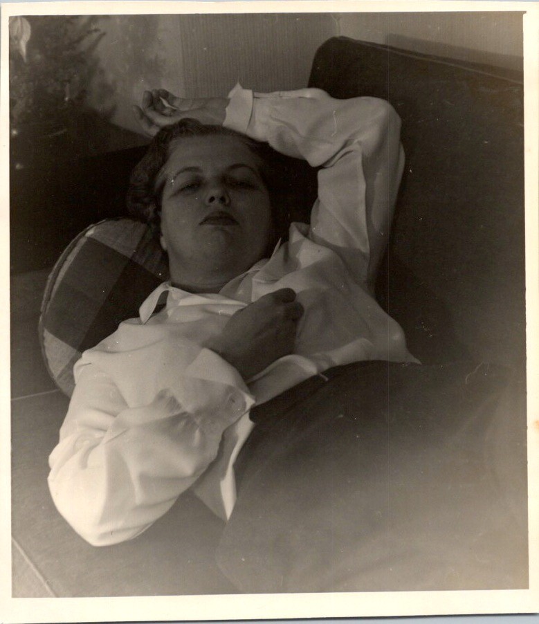 1950s Candid Photograph Woman Relaxing On Floral Print Sofa Mid Century