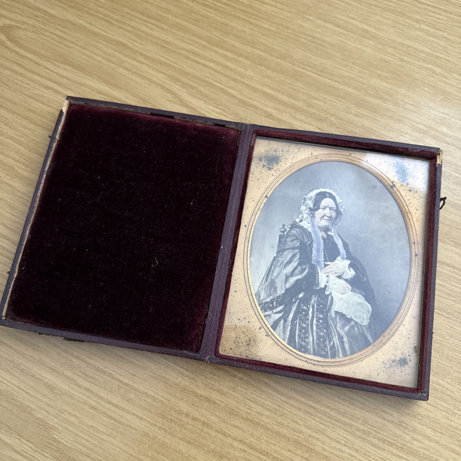 An antique leather cased photograph of a Victorian lady