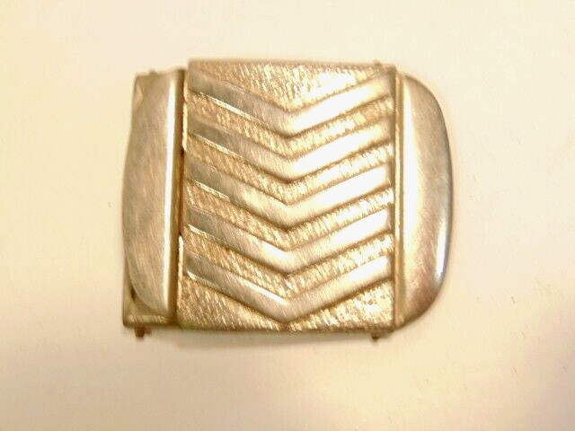 older chrome plated brass belt buckle with chevron or stripe design older chrome plated brass belt buckle with chevron or stripe design