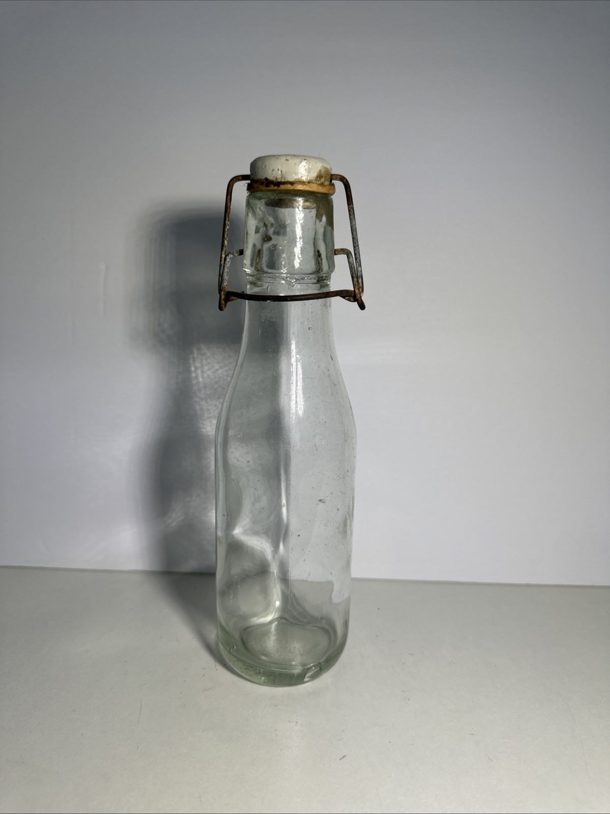 VTG Clear Bottle with Wire and Porcelain Top, 20” Tall