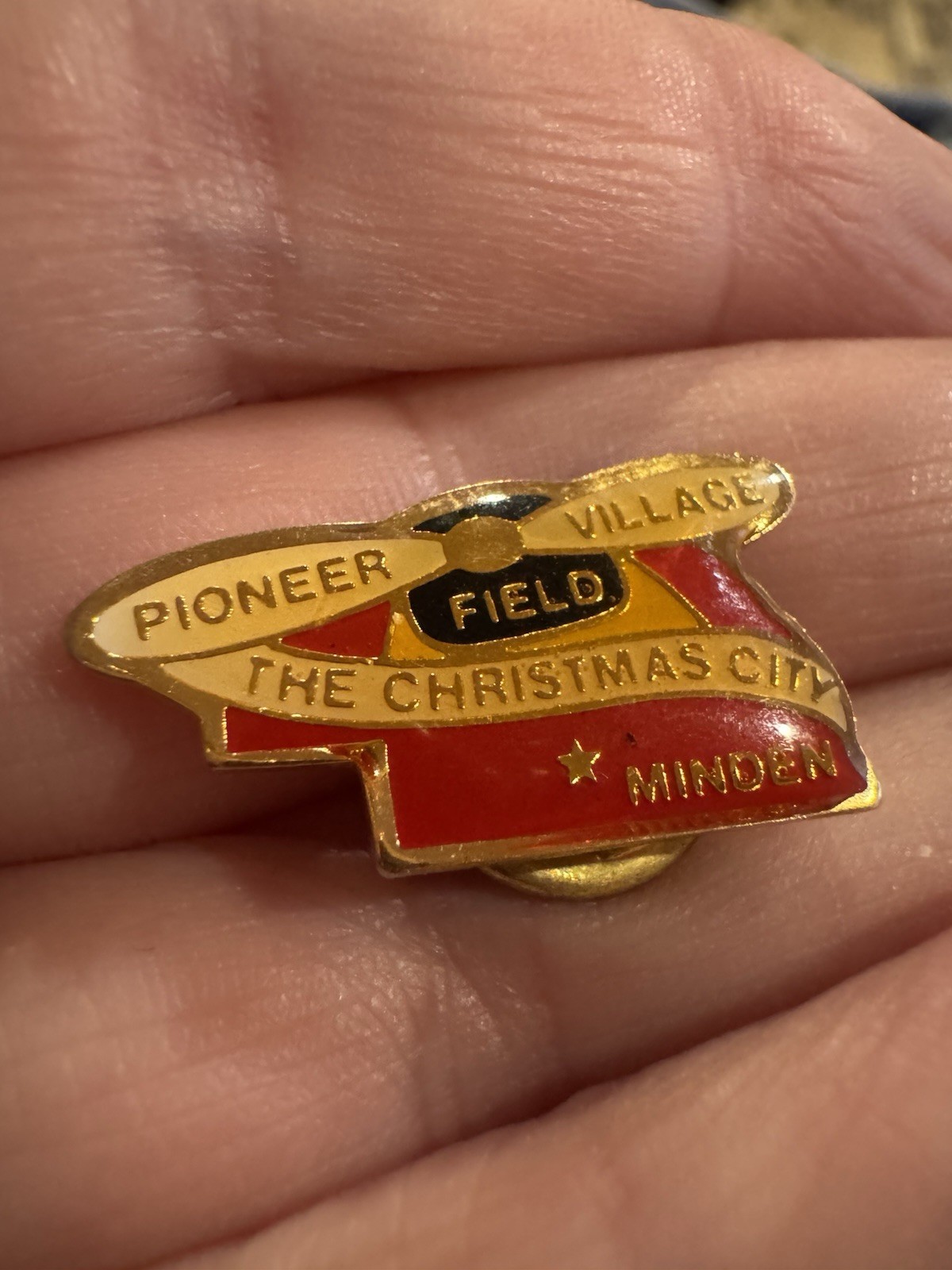 Pioneer Village Minden Nebraska souvenir Lapel Hat Pin Helicopter Christmas