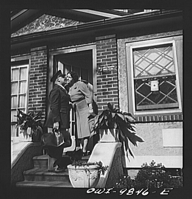Photo:Brooklyn New York 1940s Couple Kissing at Brick House Doorway