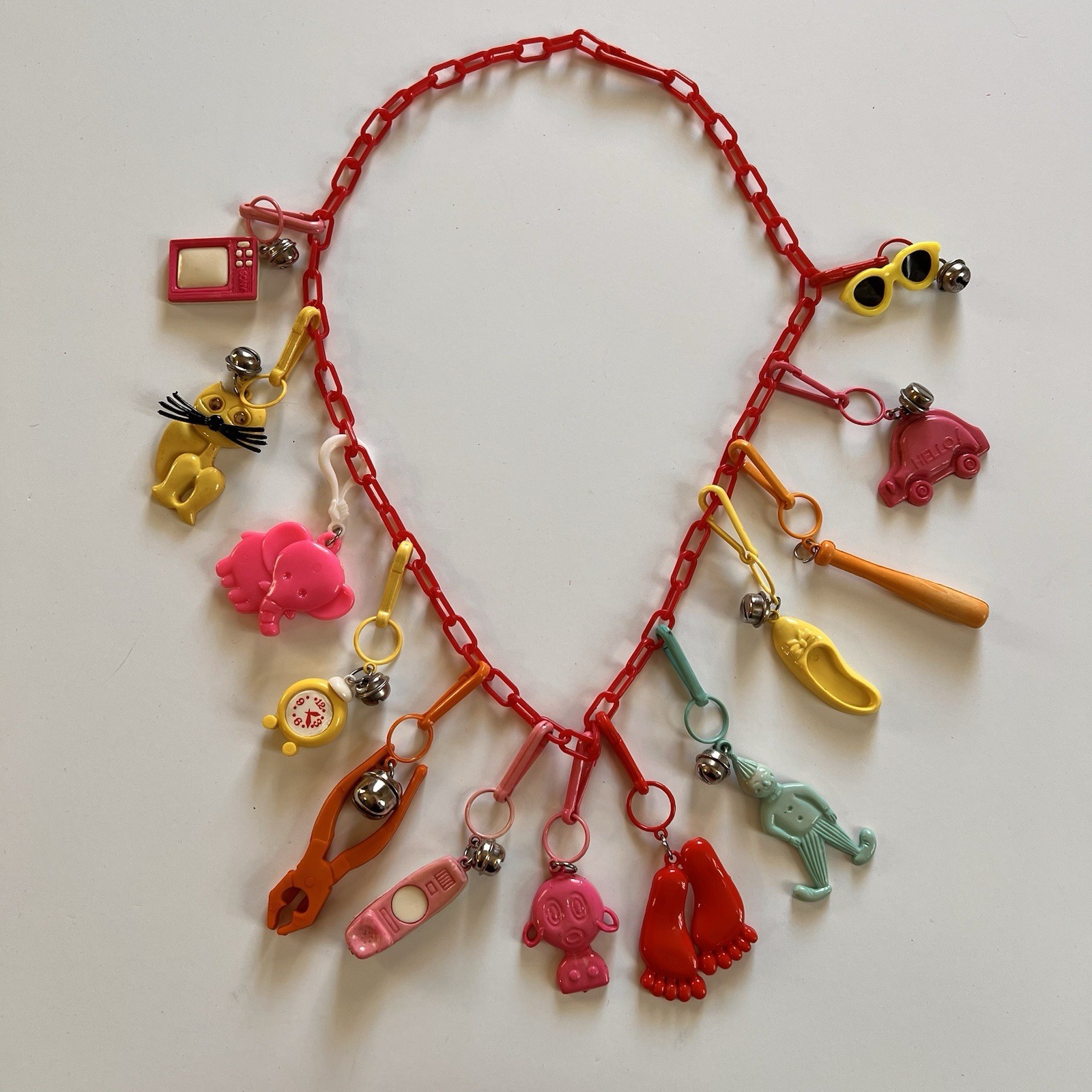 Vintage 80s Plastic Clip On Bell Charm Necklace 12 Charms