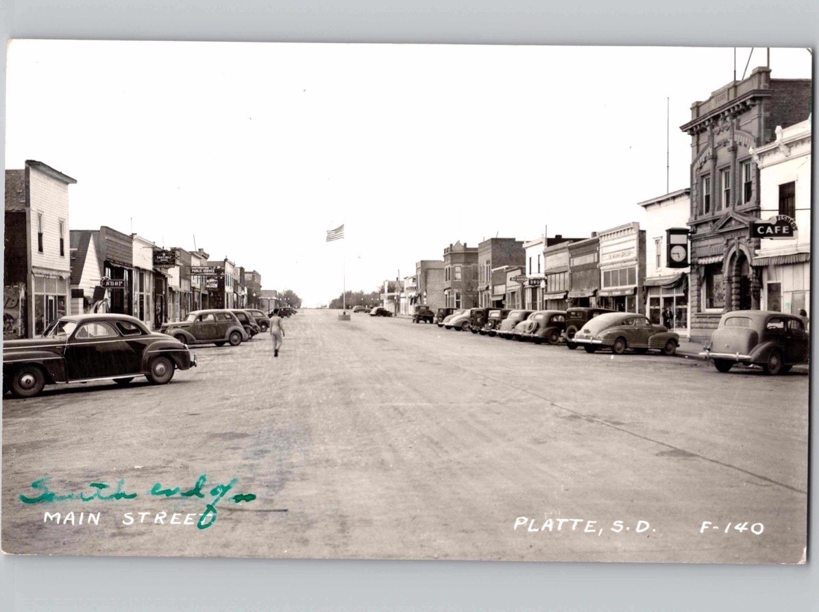 c1945 Main Street Scene Cafe & Cars Platte South Dakota SD RPPC Photo Postcard