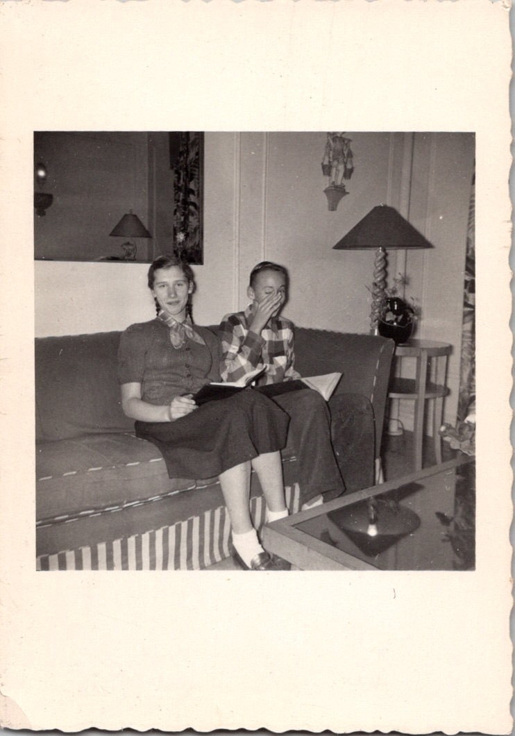 Two Young People Reading 1940s-1950s Snapshot Photograph Domestic Life Candid